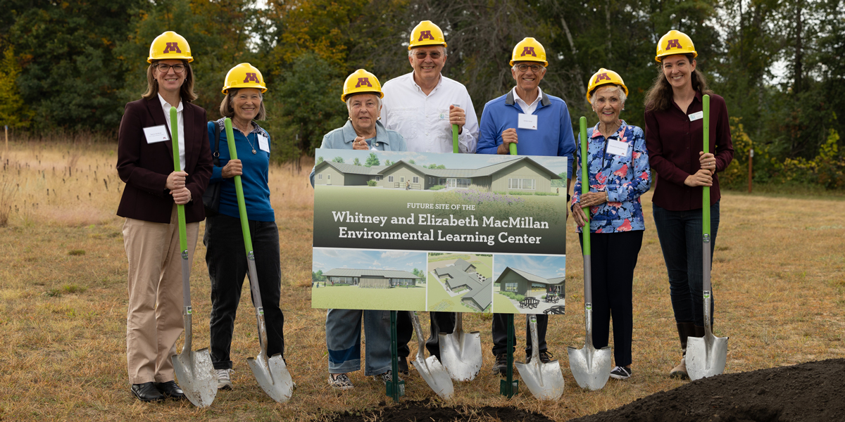A group standing at the construction kickoff for the MacMillan Environmental Learning Center